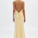 MISHA (yellow/butter) The Honor satin v-neck bow maxi